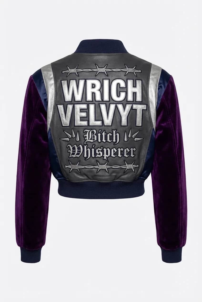 Bitch Whisperer bomber in amethyst velvet — silver foil paneling, gothic script. Drops Friday.
